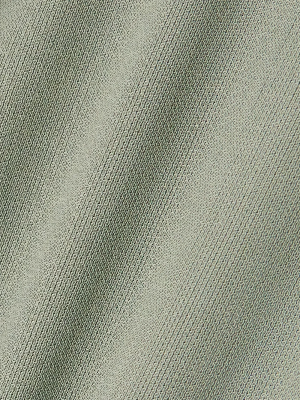 Close-up detail of the Victoria Beckham Paneled Crepe Midi Dress