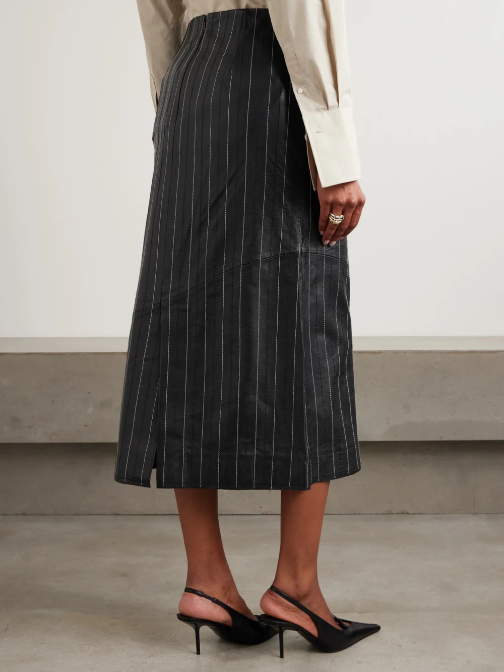 Back view of the Victoria Beckham Paneled Embroidered Pinstriped Leather Midi Skirt