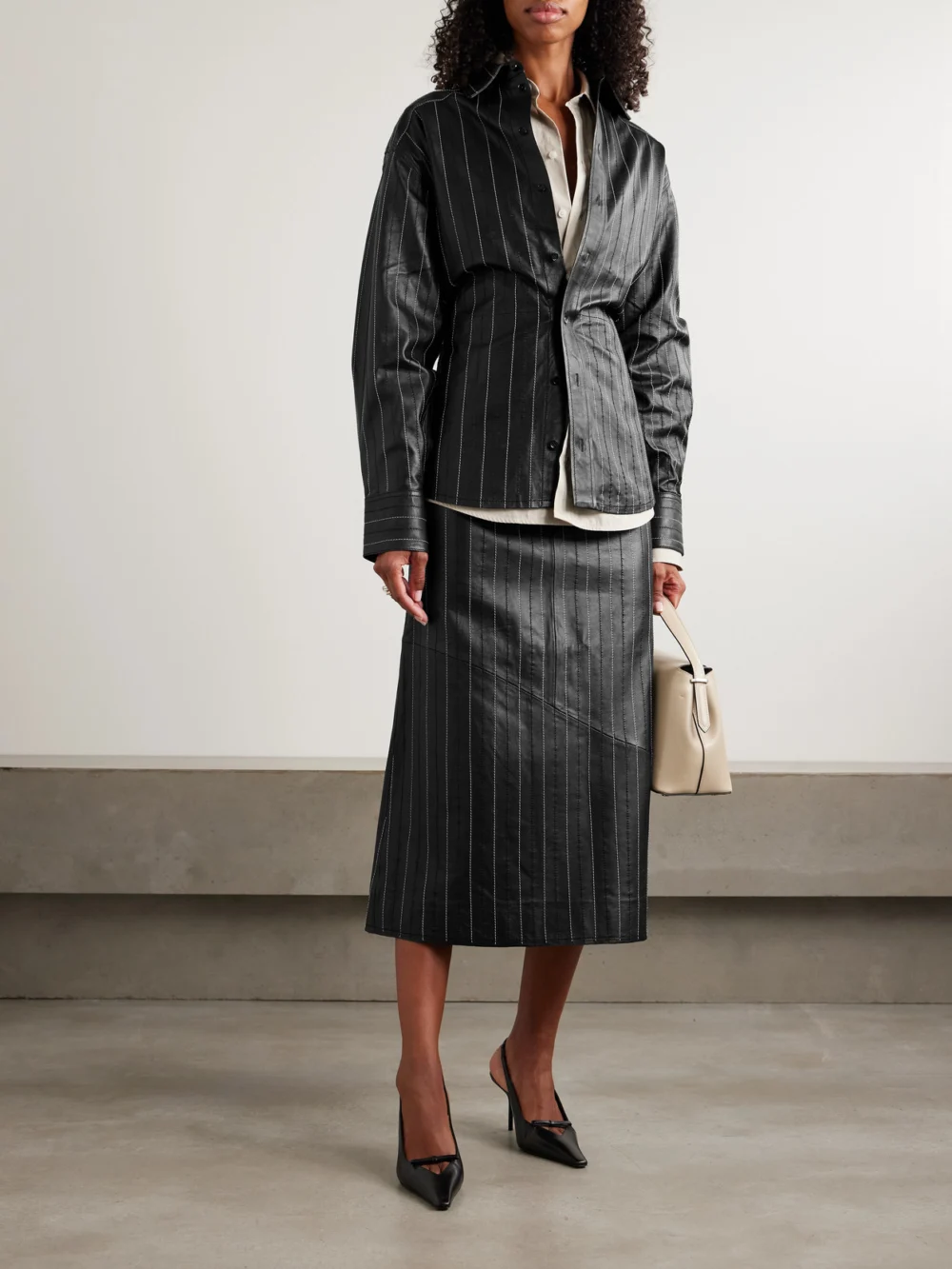 Victoria Beckham Paneled Embroidered Pinstriped Leather Midi Skirt, worn by a model