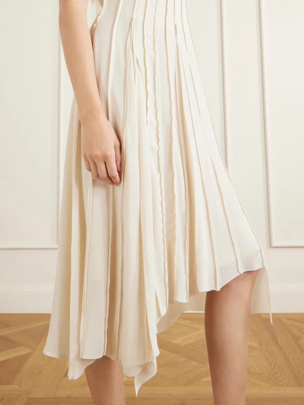 Close-up detail of the Victoria Beckham Pleated Cady Midi Dress