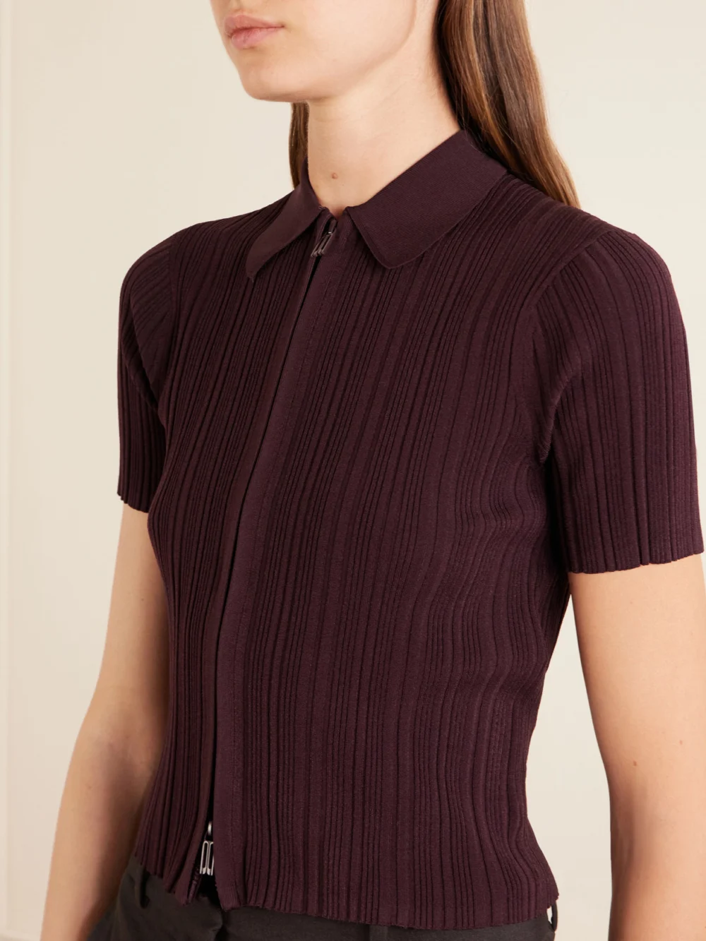 Close-up detail of the Victoria Beckham Ribbed Polo Top
