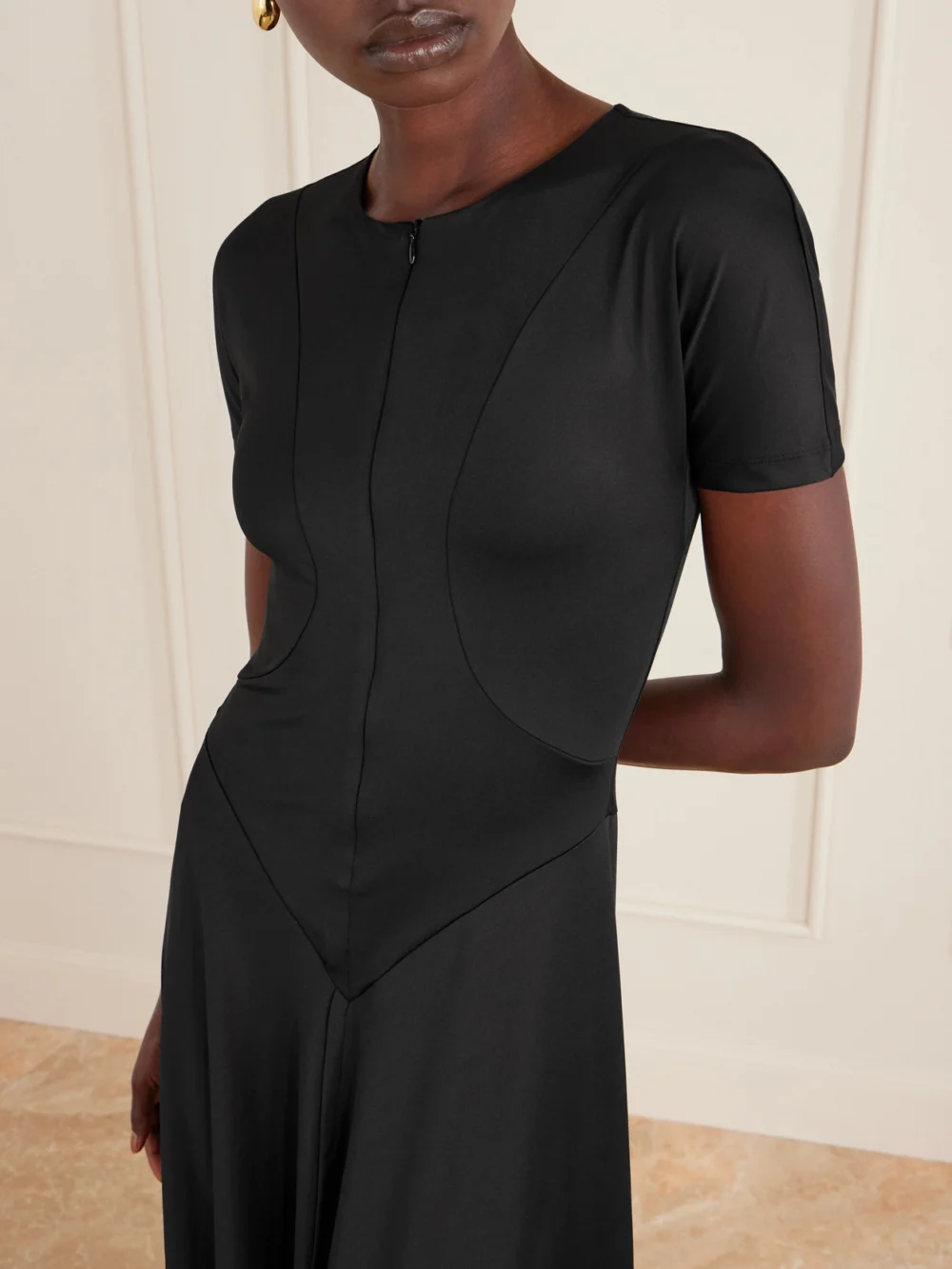 Close-up detail of the Victoria Beckham Stretch-jersey Zip-up Midi Dress