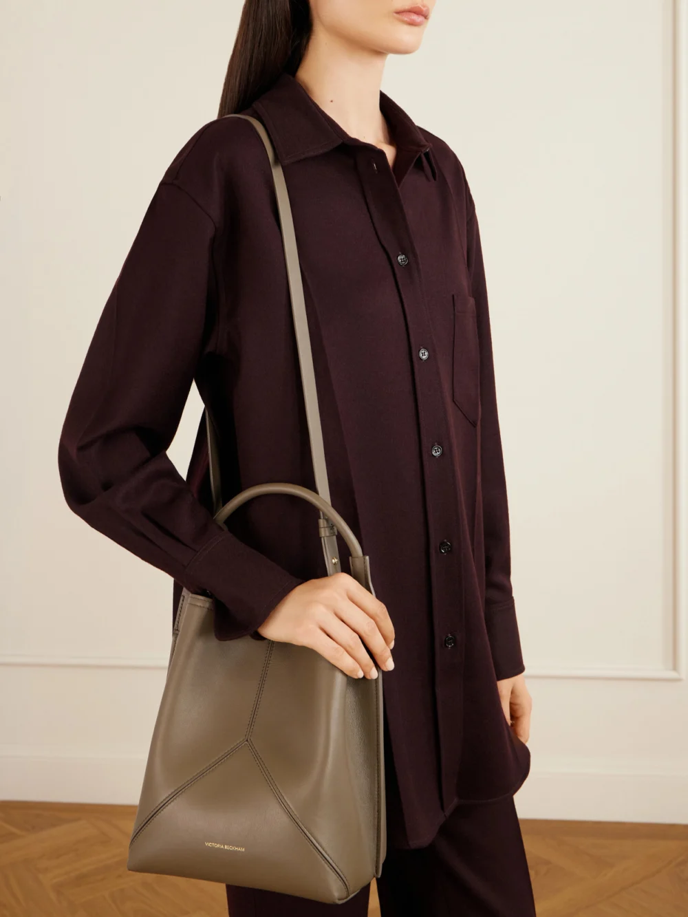 Victoria Beckham The Victoria Bucket Leather Shoulder Bag, styled view