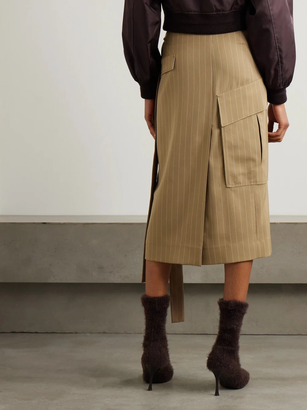 Back view of the Victoria Beckham Tie-detailed Pinstriped Wool-twill Midi Wrap Skirt
