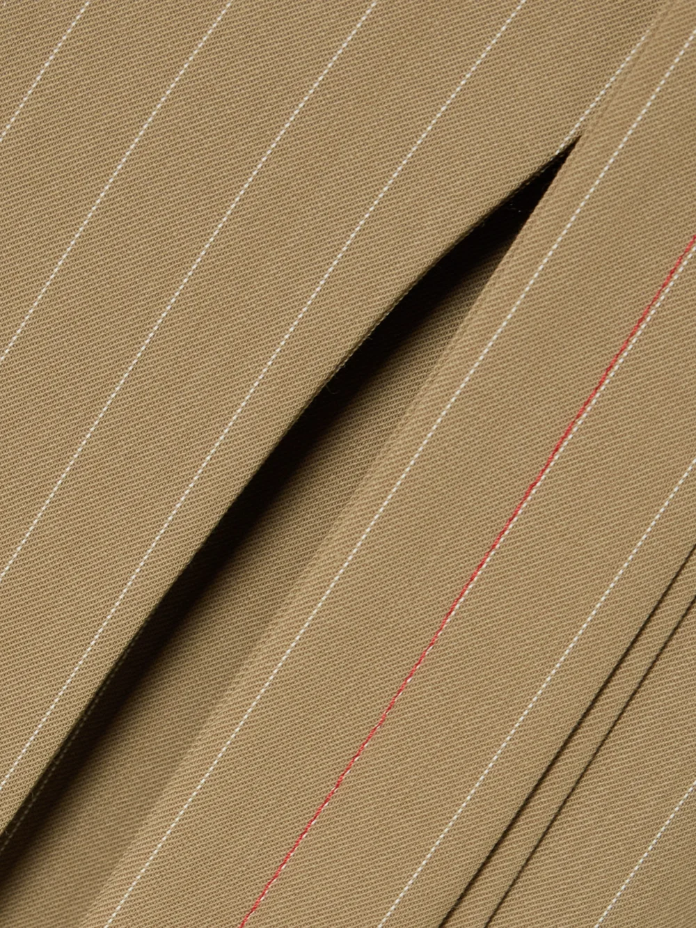 Close-up detail of the Victoria Beckham Tie-detailed Pinstriped Wool-twill Midi Wrap Skirt
