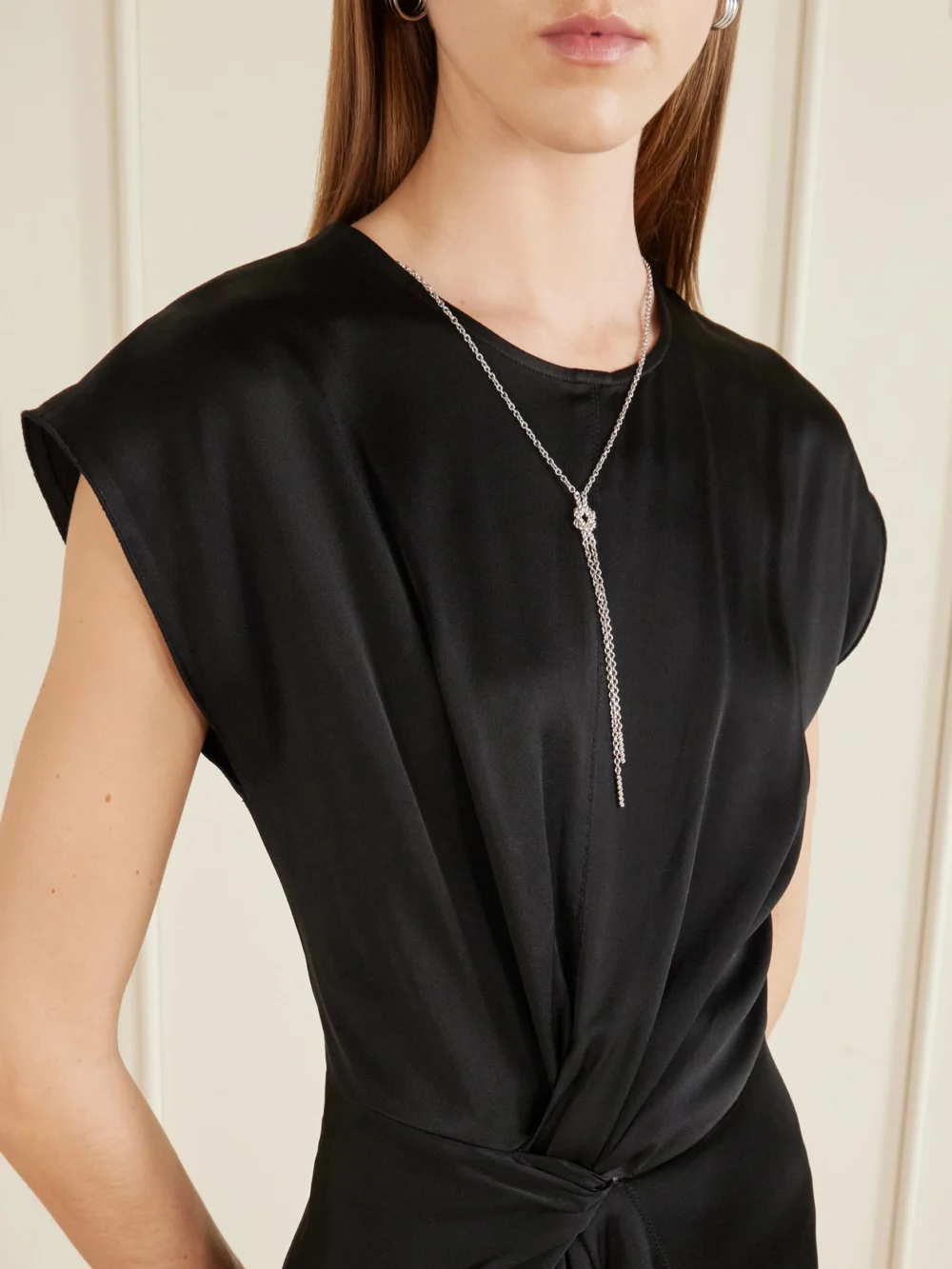 Close-up detail of the Victoria Beckham Twisted-front Satin Midi Dress