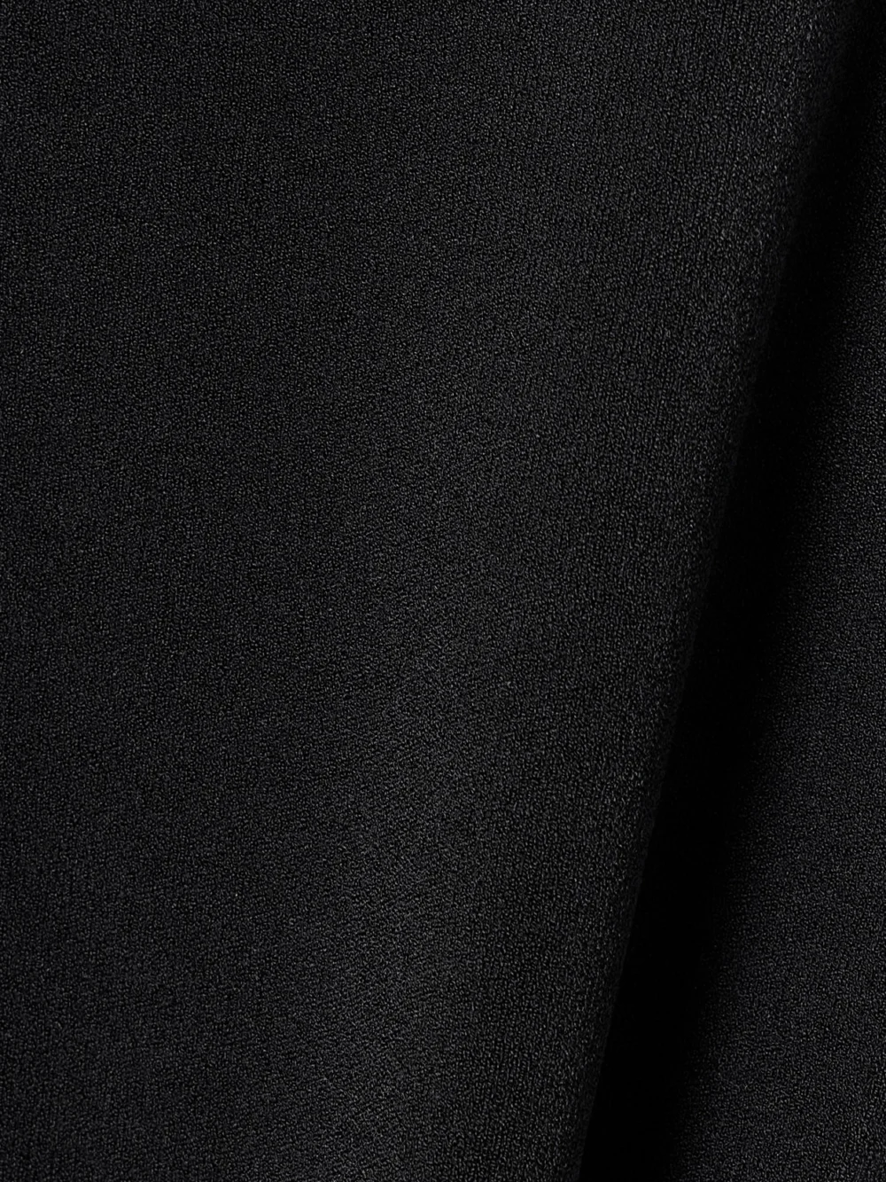 Close-up detail of the Victoria Beckham Vb Body Ruffled Stretch-knit Midi Dress