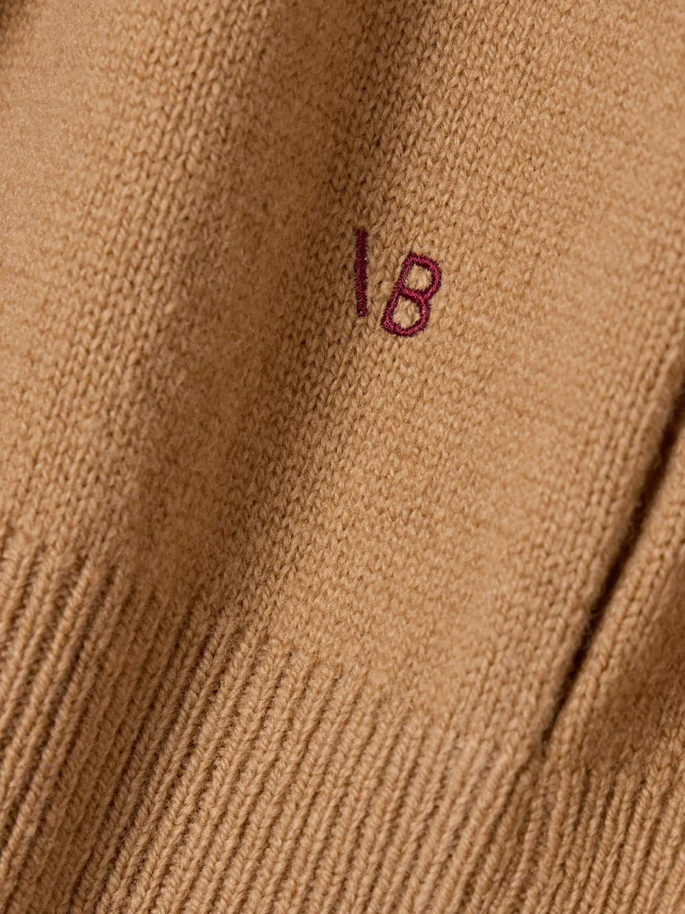 Close-up detail of the Victoria Beckham Wool Turtleneck Sweater