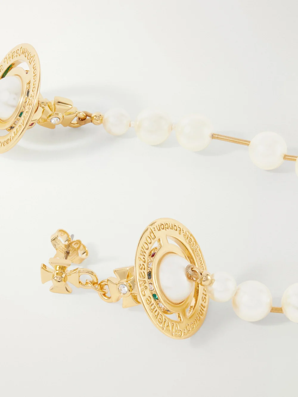 Close-up detail of the Vivienne Westwood Broken Pearl Gold-tone Earrings