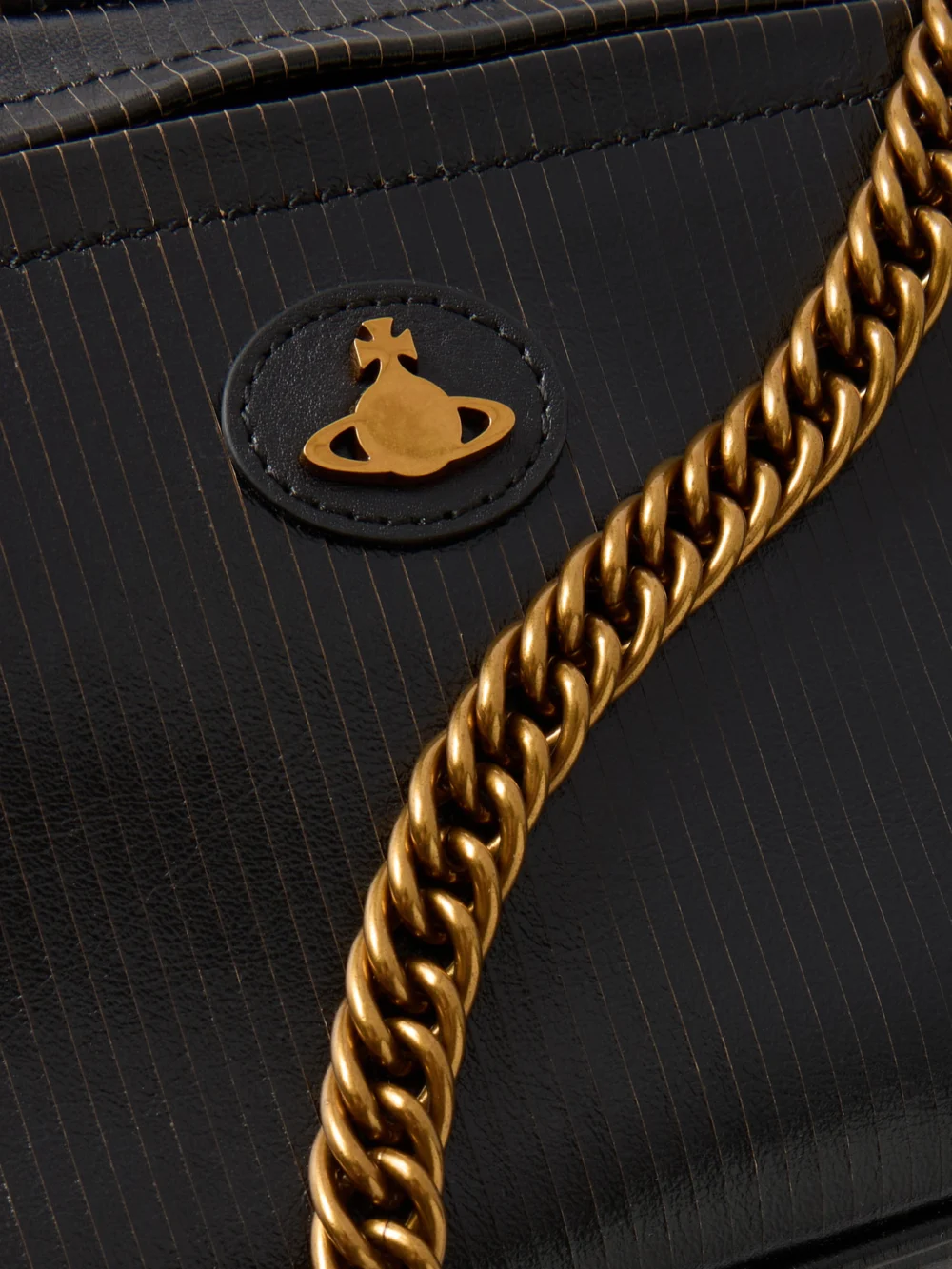 Close-up detail of the Vivienne Westwood Dolce Medium Orb-embellished Textured-leather Shoulder Bag
