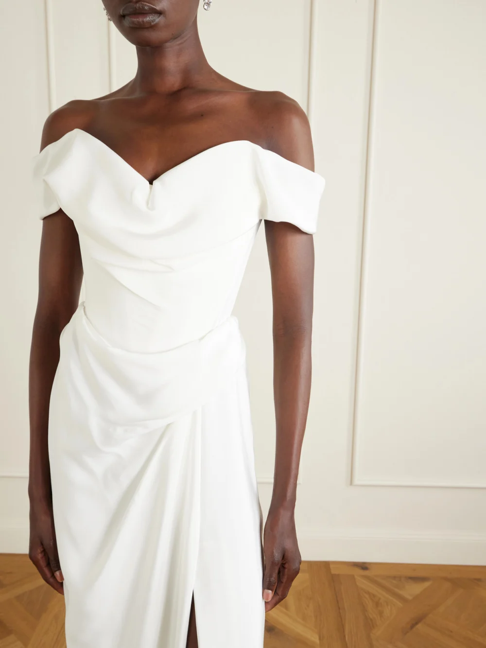 Close-up detail of the Vivienne Westwood Mabel Off-the-shoulder Draped Silk-cady Gown