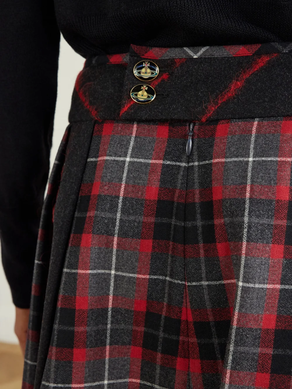Close-up detail of the Vivienne Westwood Mini Bell Checked Pleated Mini Skirt