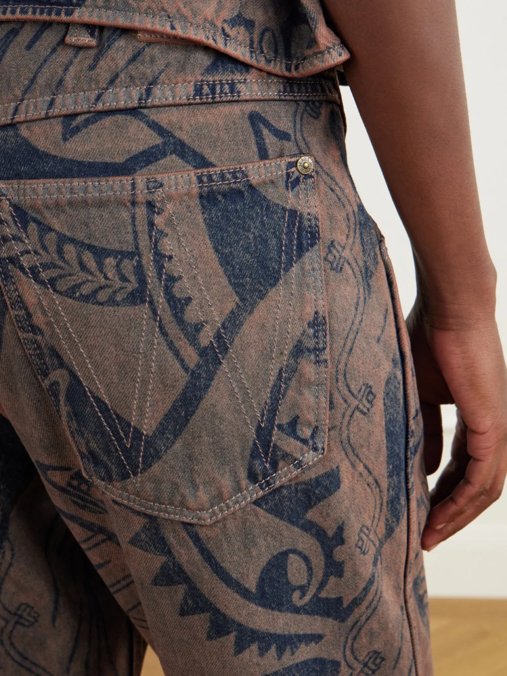 Close-up detail of the Vivienne Westwood Ranch Printed High-waisted Straight-leg Organic Jeans