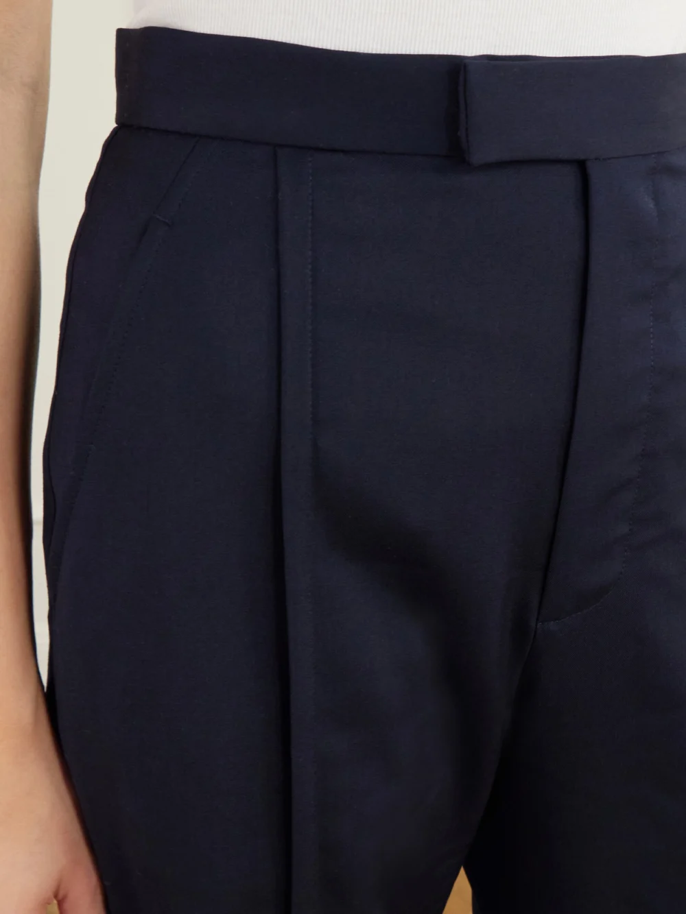 Close-up detail of the Vivienne Westwood Serge Pleated Flared Wool Pants