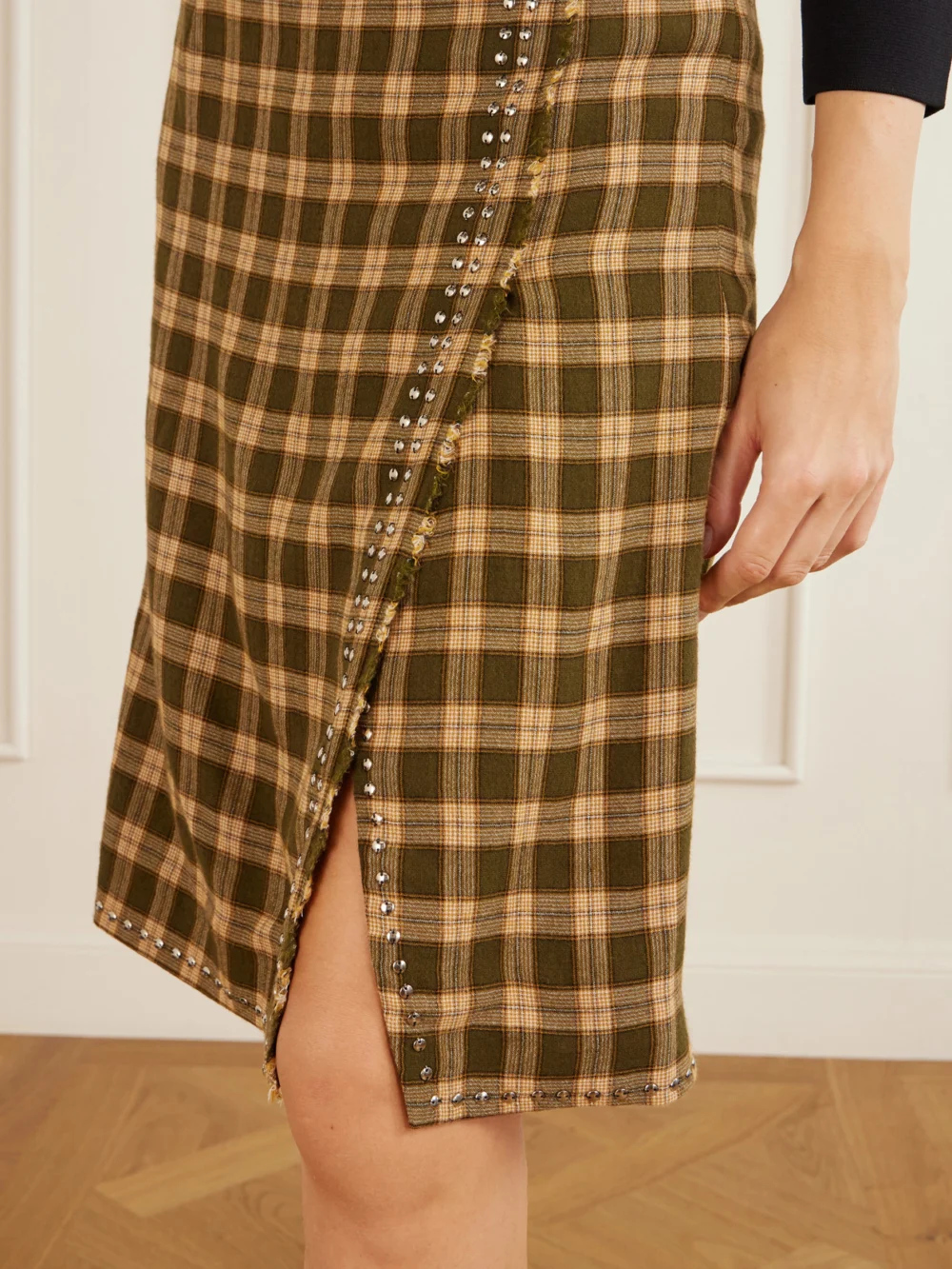 Close-up detail of the Wales Bonner Cosmic Frayed Studded Checked Flannel Mini Skirt