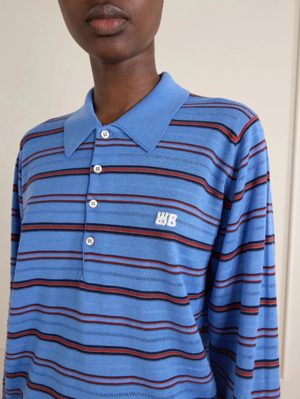 Close-up detail of the Wales Bonner Striped Wool and Cotton Polo Shirt