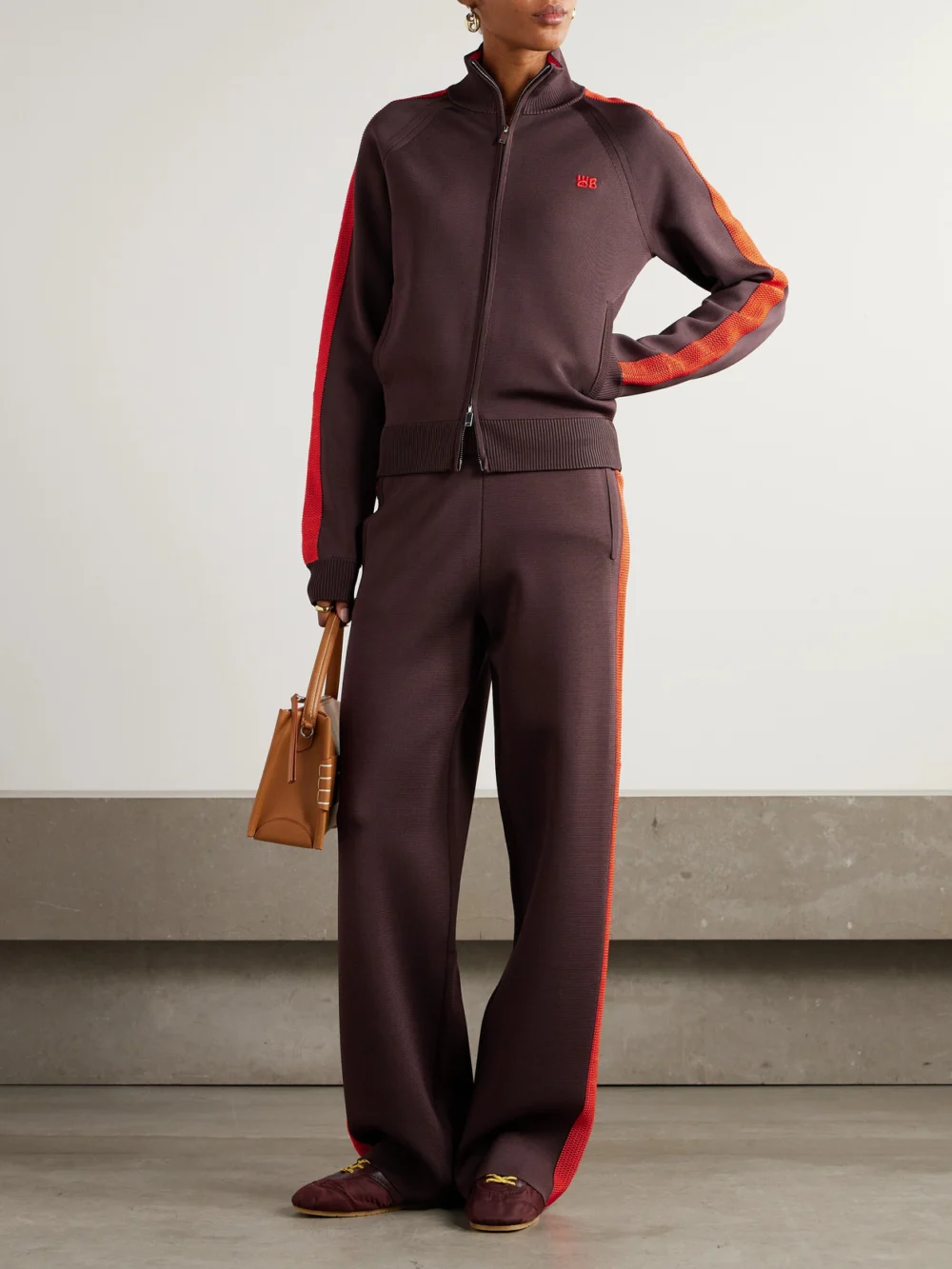 Wales Bonner Tide Striped Knitted Track Pants, worn by a model