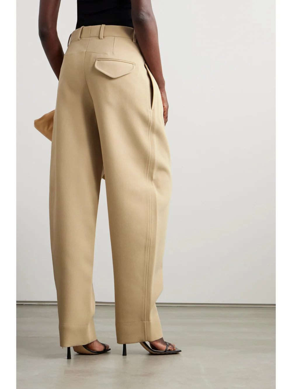 Back view of the WARDROBE.NYC + Hailey Bieber Pleated Wool-crepe Wide-leg Pants