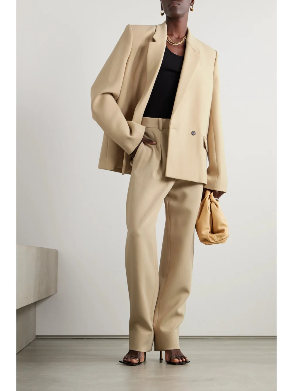 WARDROBE.NYC + Hailey Bieber Pleated Wool-crepe Wide-leg Pants, worn by a model