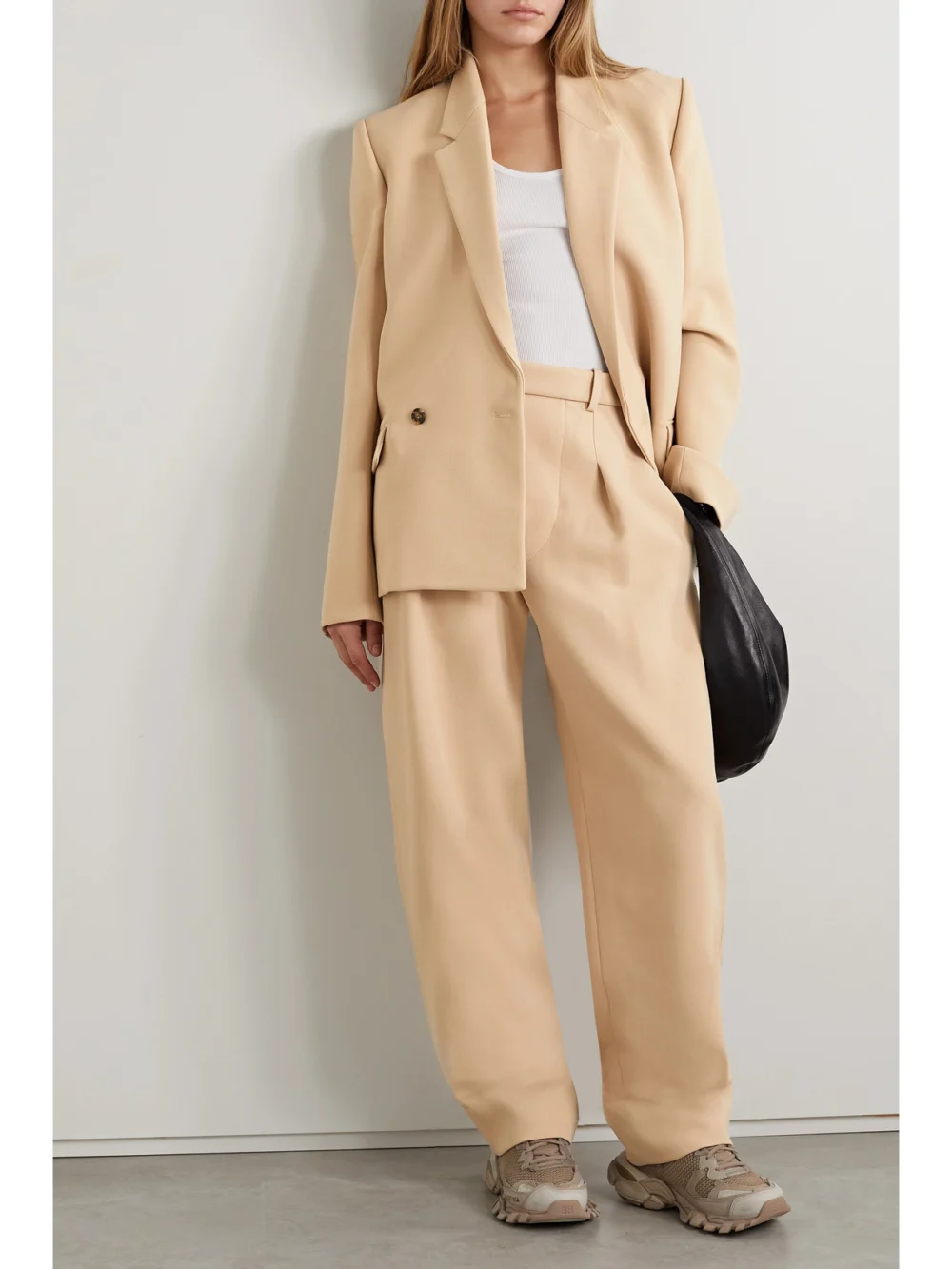 WARDROBE.NYC + Hailey Bieber Pleated Wool Wide-leg Pants, worn by a model