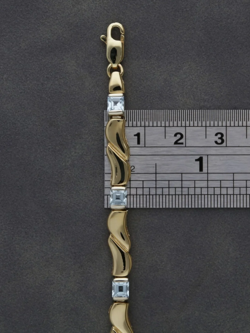 William May 9ct Gold 7" Blue Topaz Set Wave Bar Link Bracelet, view 2