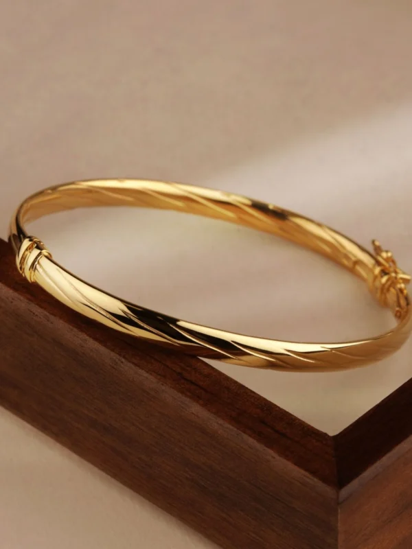 William May 9ct Gold Twisted Design Ladies Hinged Bangle