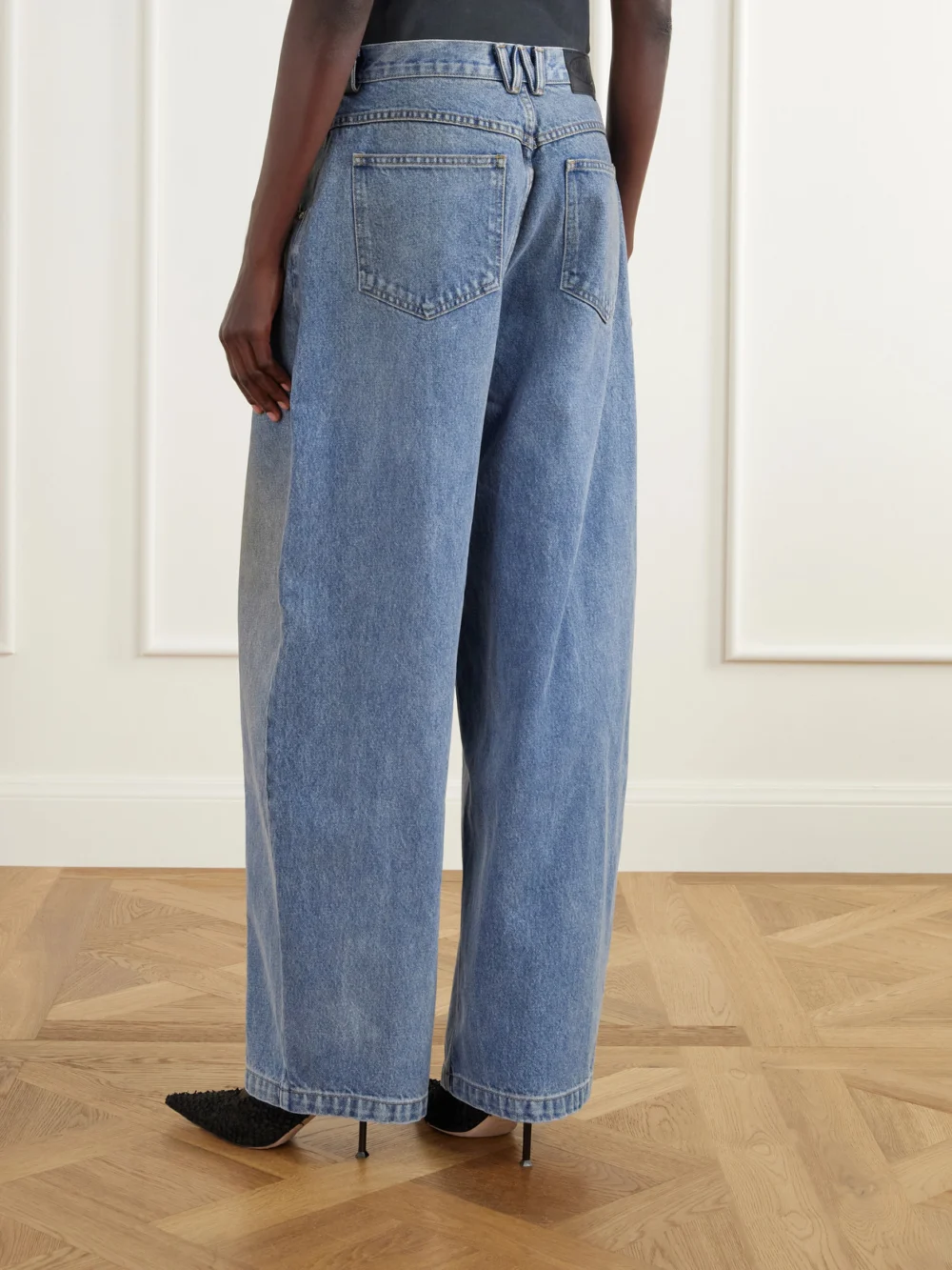 Back view of the Willy Chavarria Bad Girl Distressed High-rise Barrel-leg Jeans