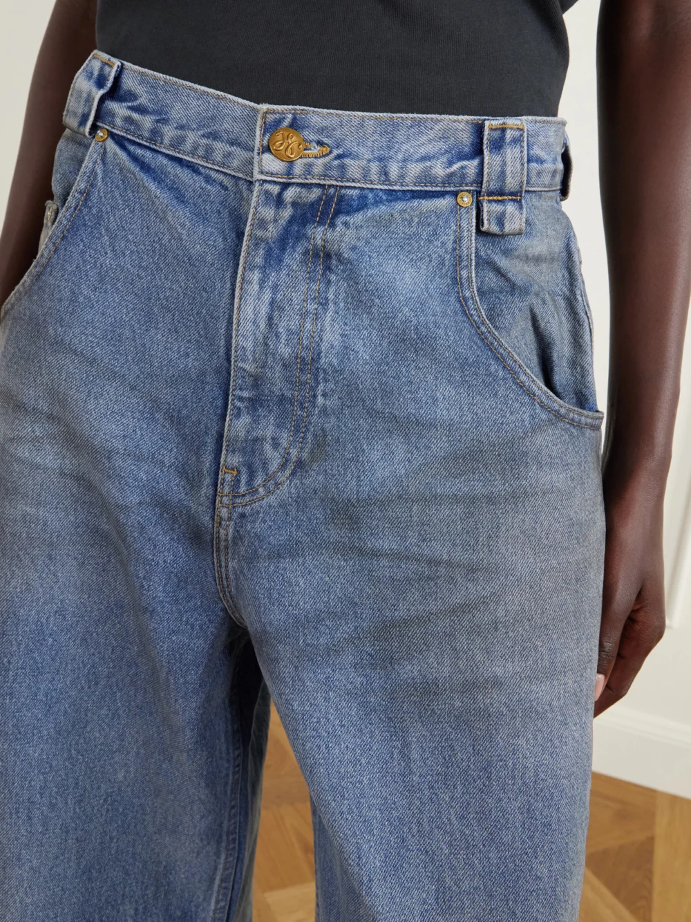 Close-up detail of the Willy Chavarria Bad Girl Distressed High-rise Barrel-leg Jeans
