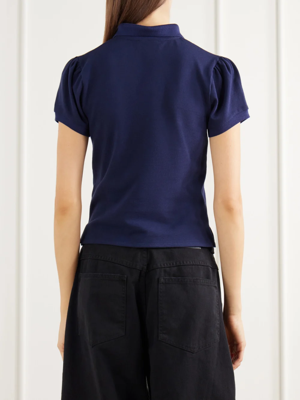 Back view of the Willy Chavarria Chavela Logo-embroidered Cotton-piqué Polo Shirt