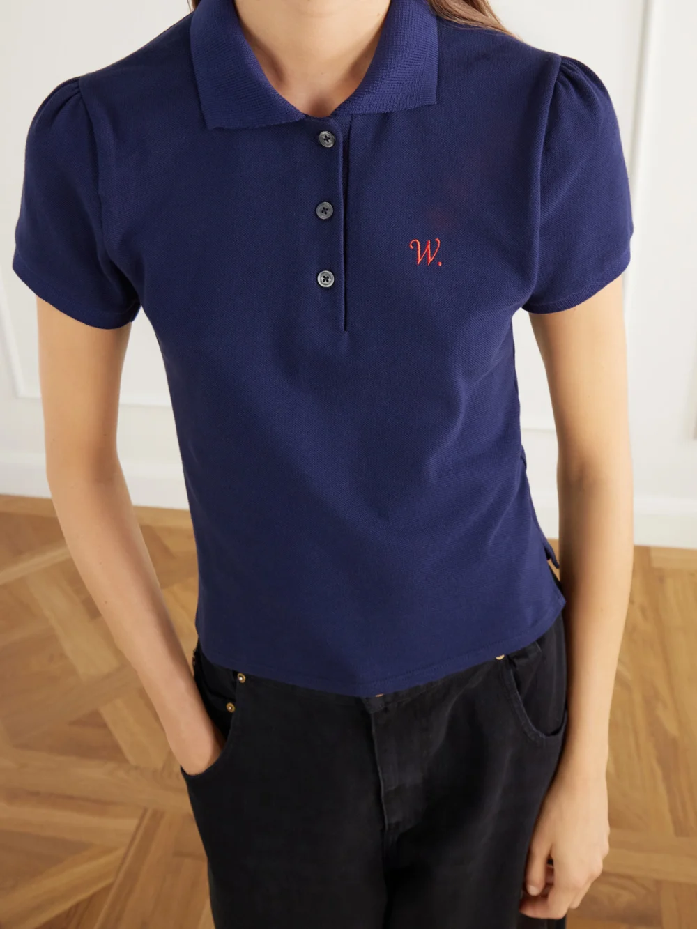 Close-up detail of the Willy Chavarria Chavela Logo-embroidered Cotton-piqué Polo Shirt