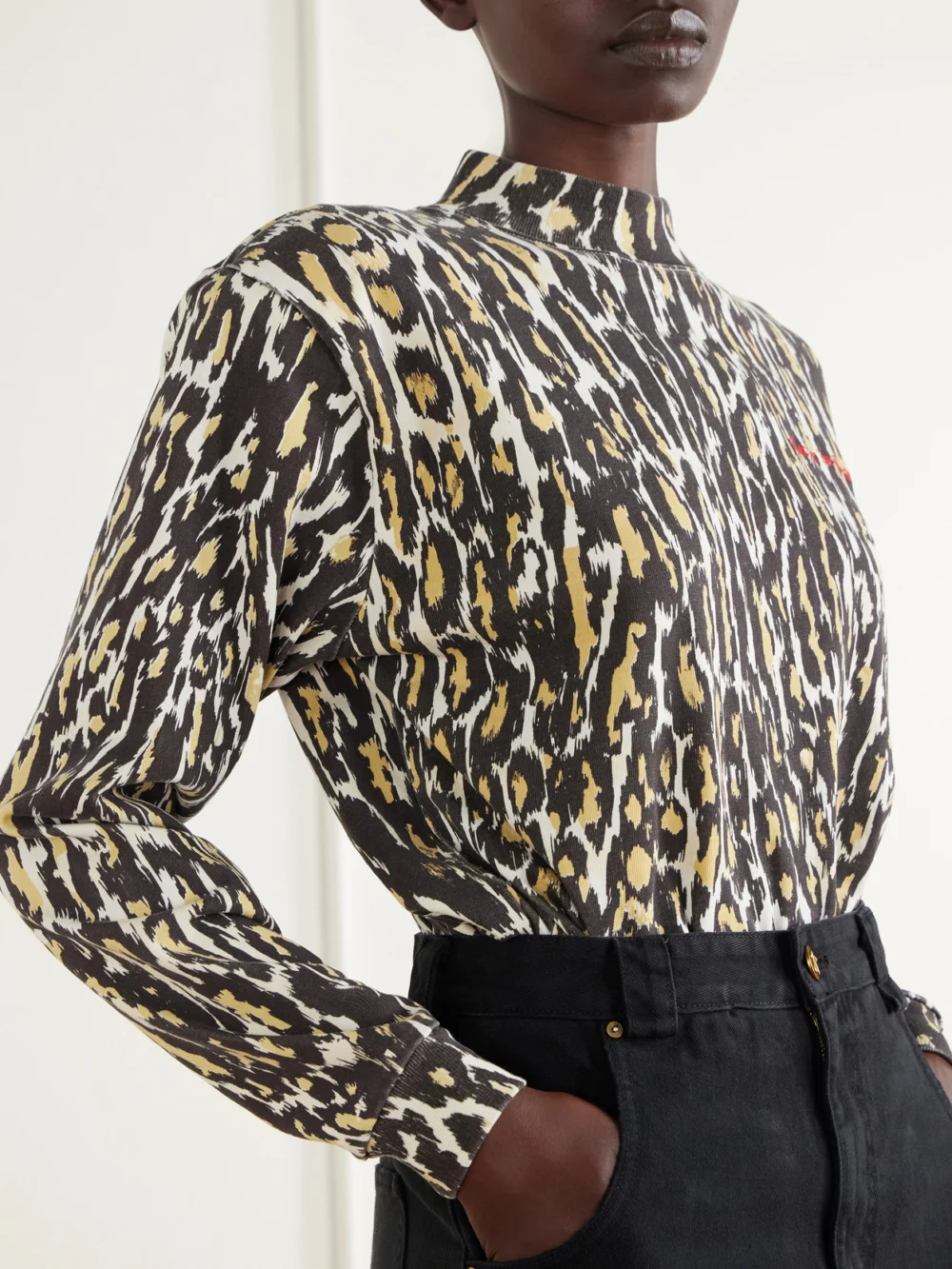 Close-up detail of the Willy Chavarria Cheetah Logo-embroidered Print Cotton-jersey Bodysuit
