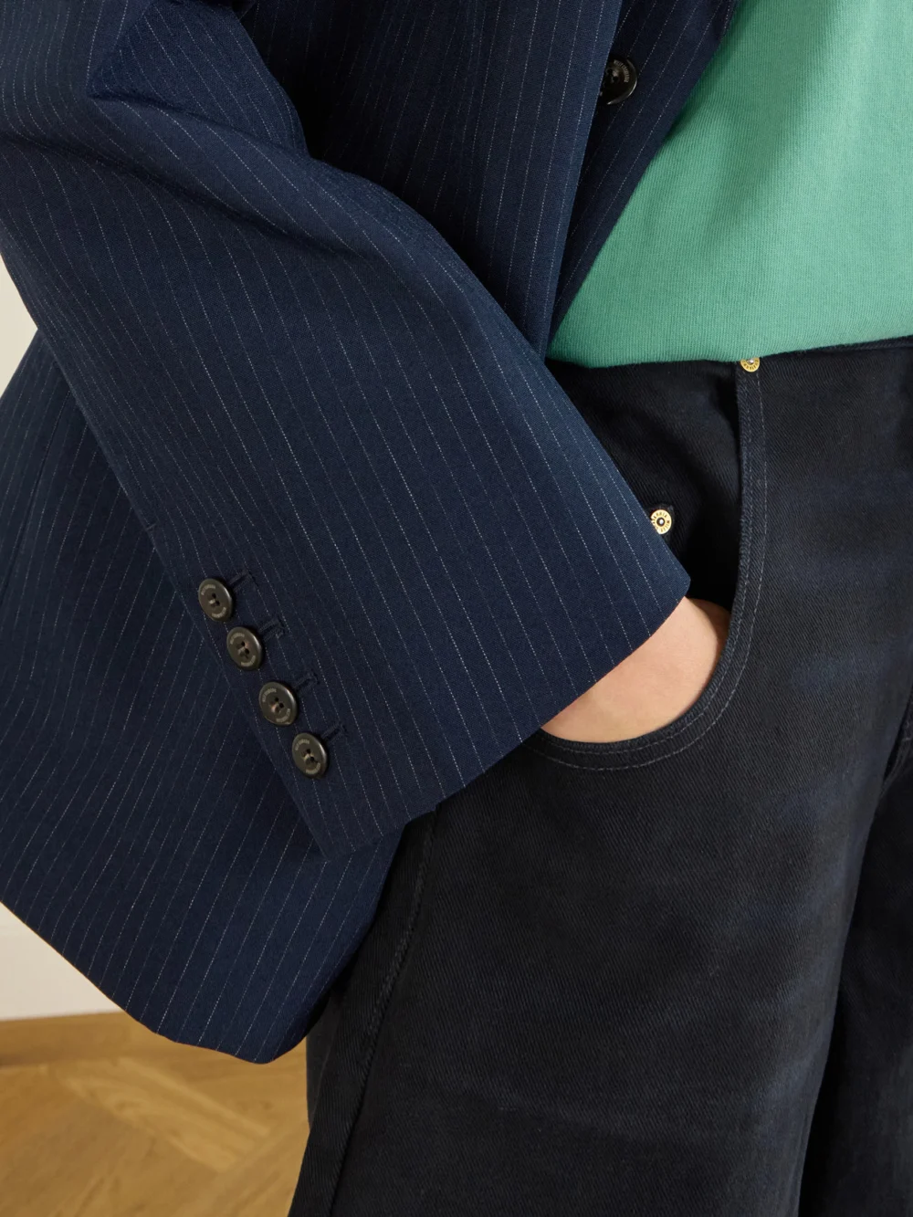 Close-up detail of the Willy Chavarria Chuco Pinstriped Woven Blazer
