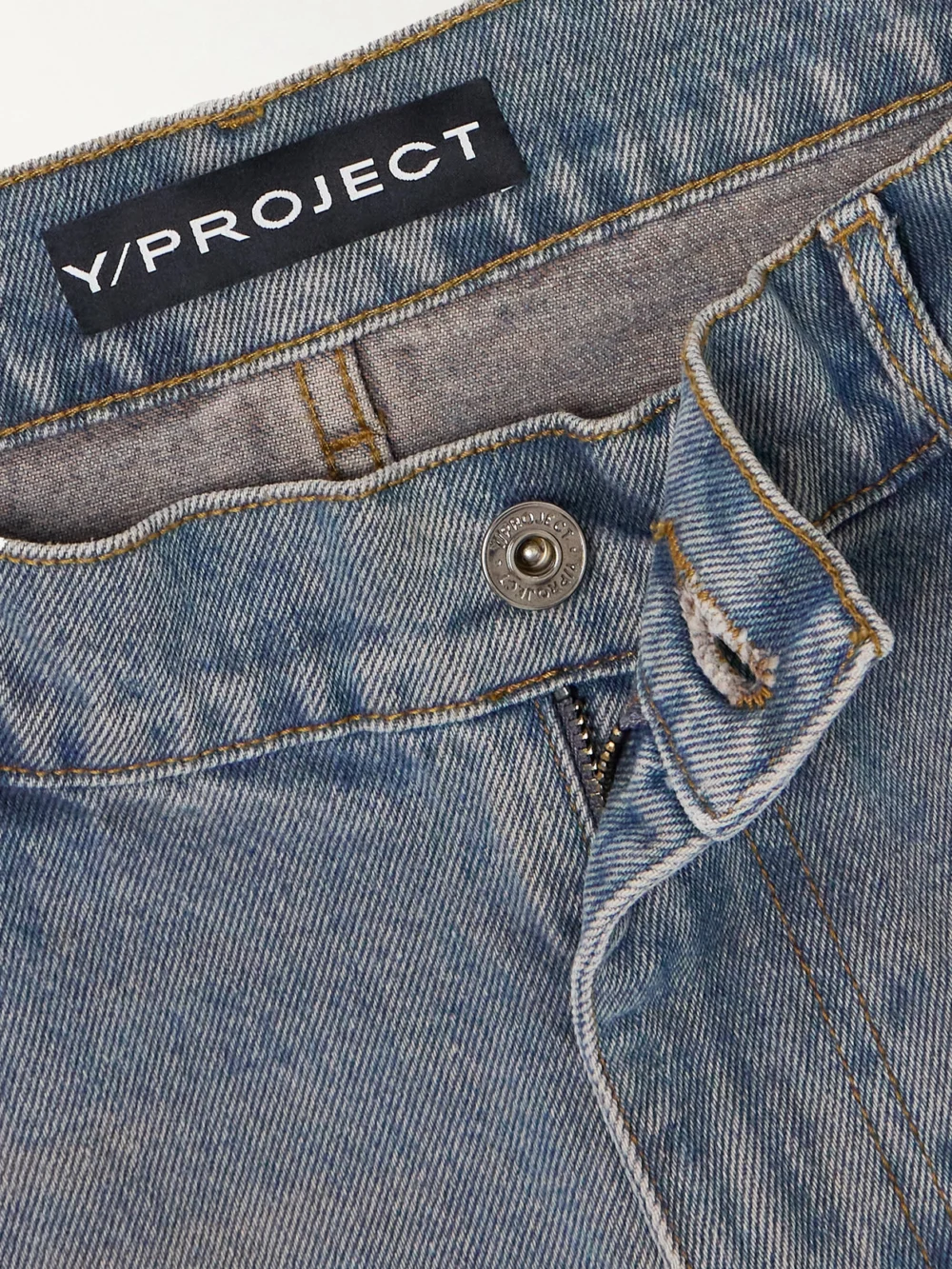 Close-up detail of the Y/Project Convertible Low-rise Straight-leg Jeans