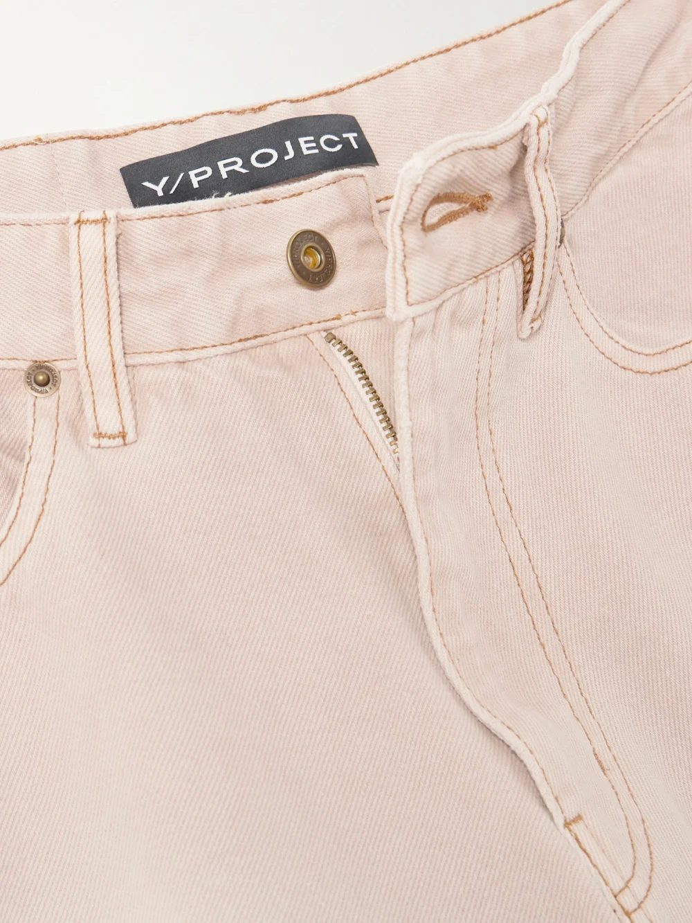 Close-up detail of the Y/Project Gathered Mid-rise Wide-leg Jeans