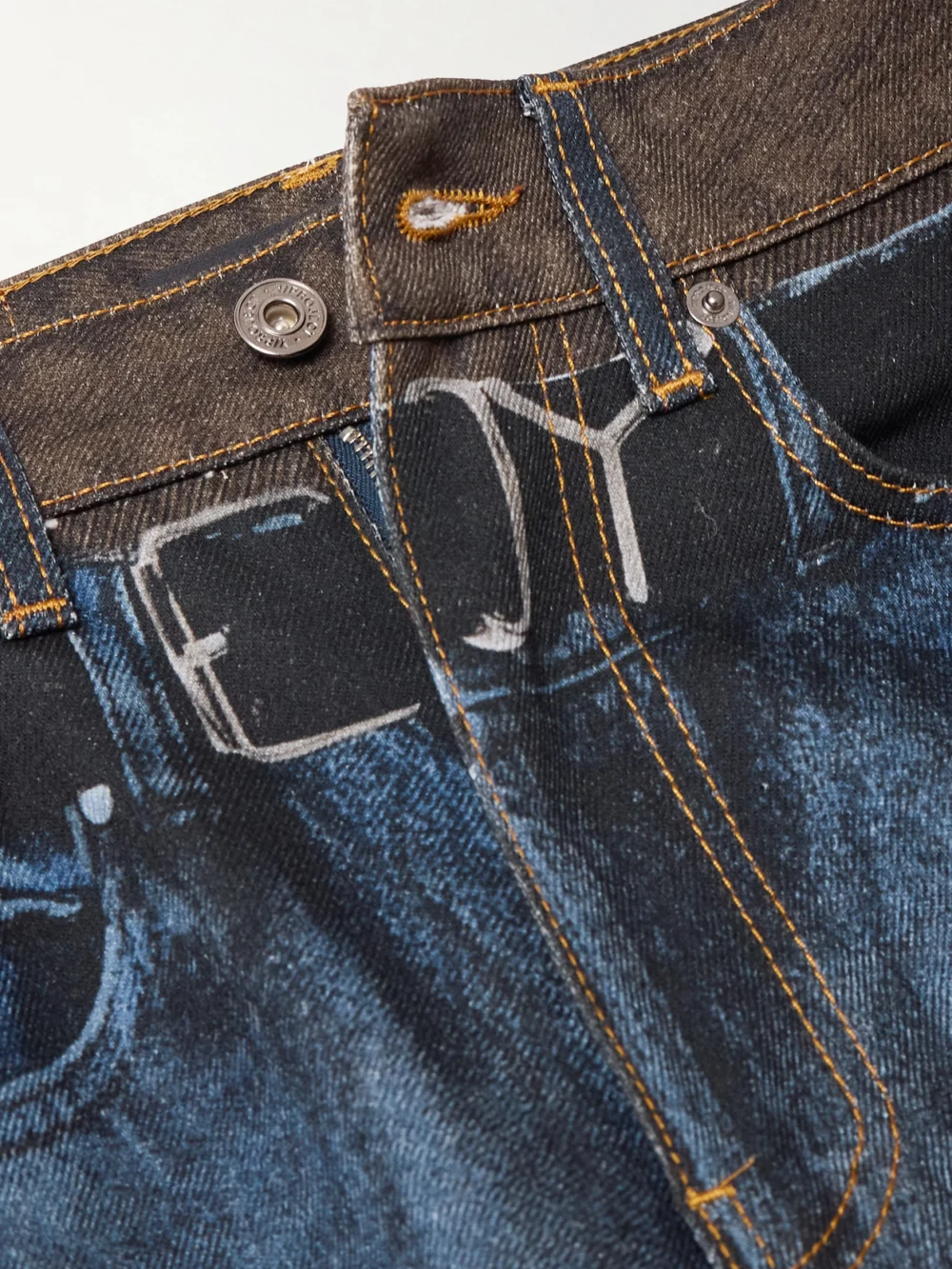 Close-up detail of the Y/Project Printed High-rise Slim-leg Jeans