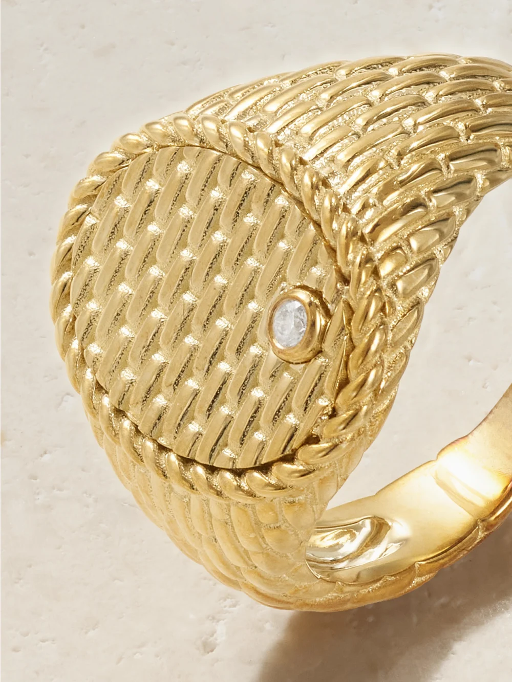 Close-up detail of the Yvonne Léon Chevaliere Ovale Cannage 9-karat Gold Diamond Signet Ring