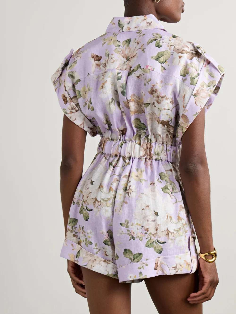 Back view of the Zimmermann Acacia Belted Floral-print Linen Playsuit