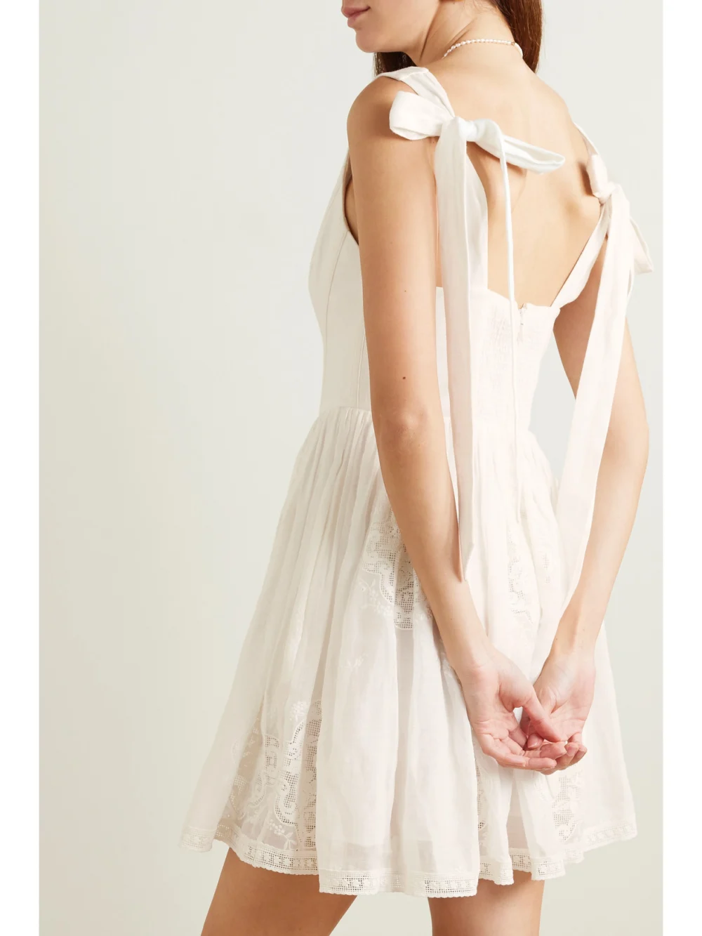 Back view of the Zimmermann Alight Lace-trimmed Ramie Bustier Mini Dress