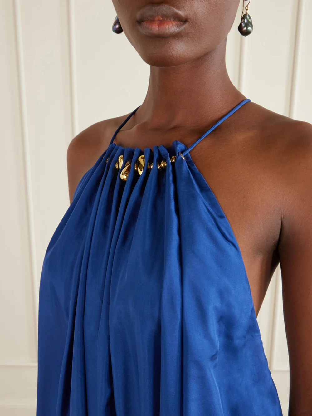 Close-up detail of the Zimmermann Aster Gathered Beaded Silk-satin Maxi Dress