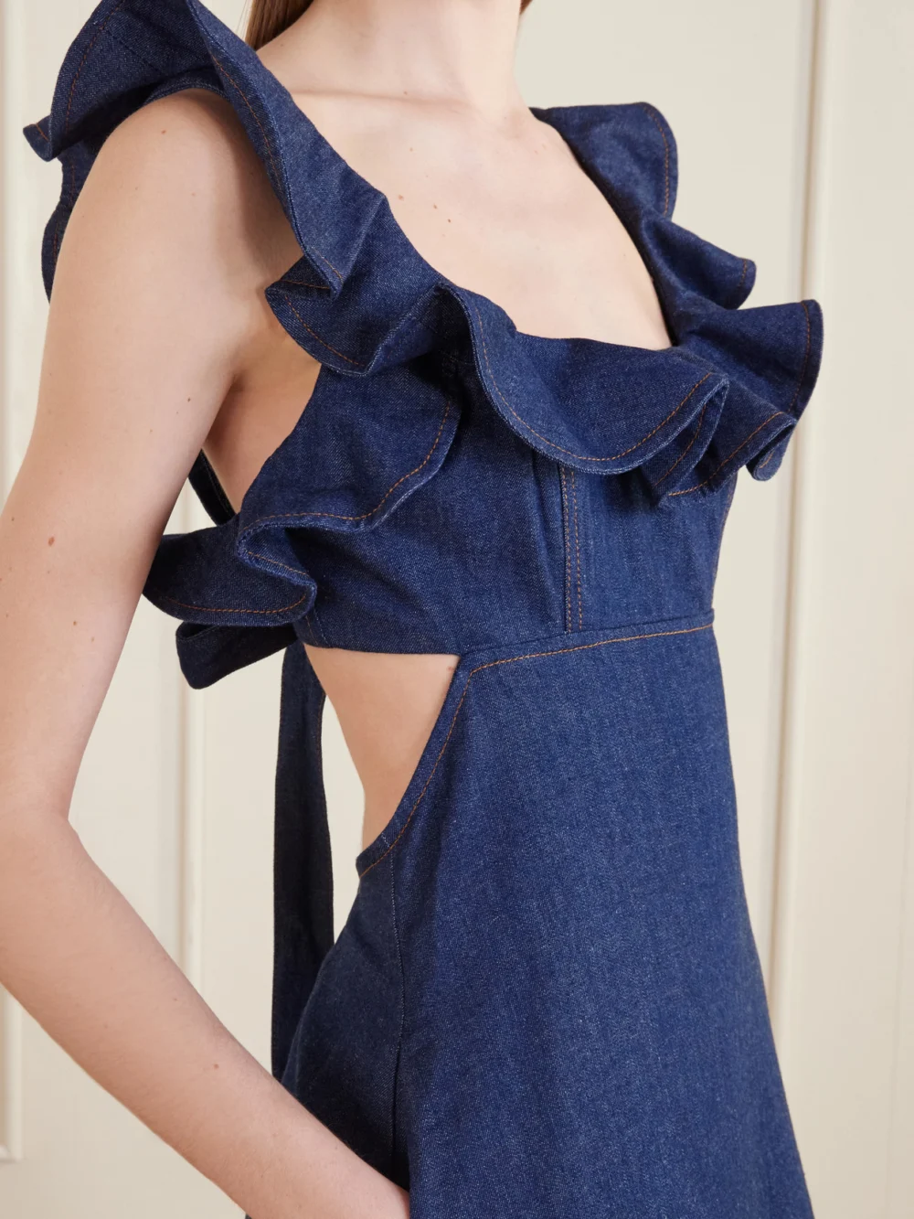 Close-up detail of the Zimmermann Aster Ruffled Denim Midi Dress