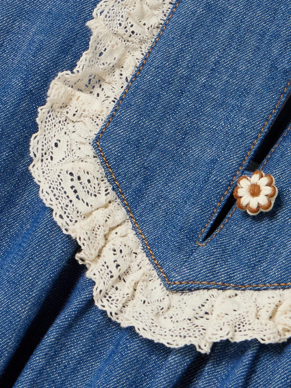 Close-up detail of the Zimmermann Awaken Belted Lace-trimmed Denim Mini Dress