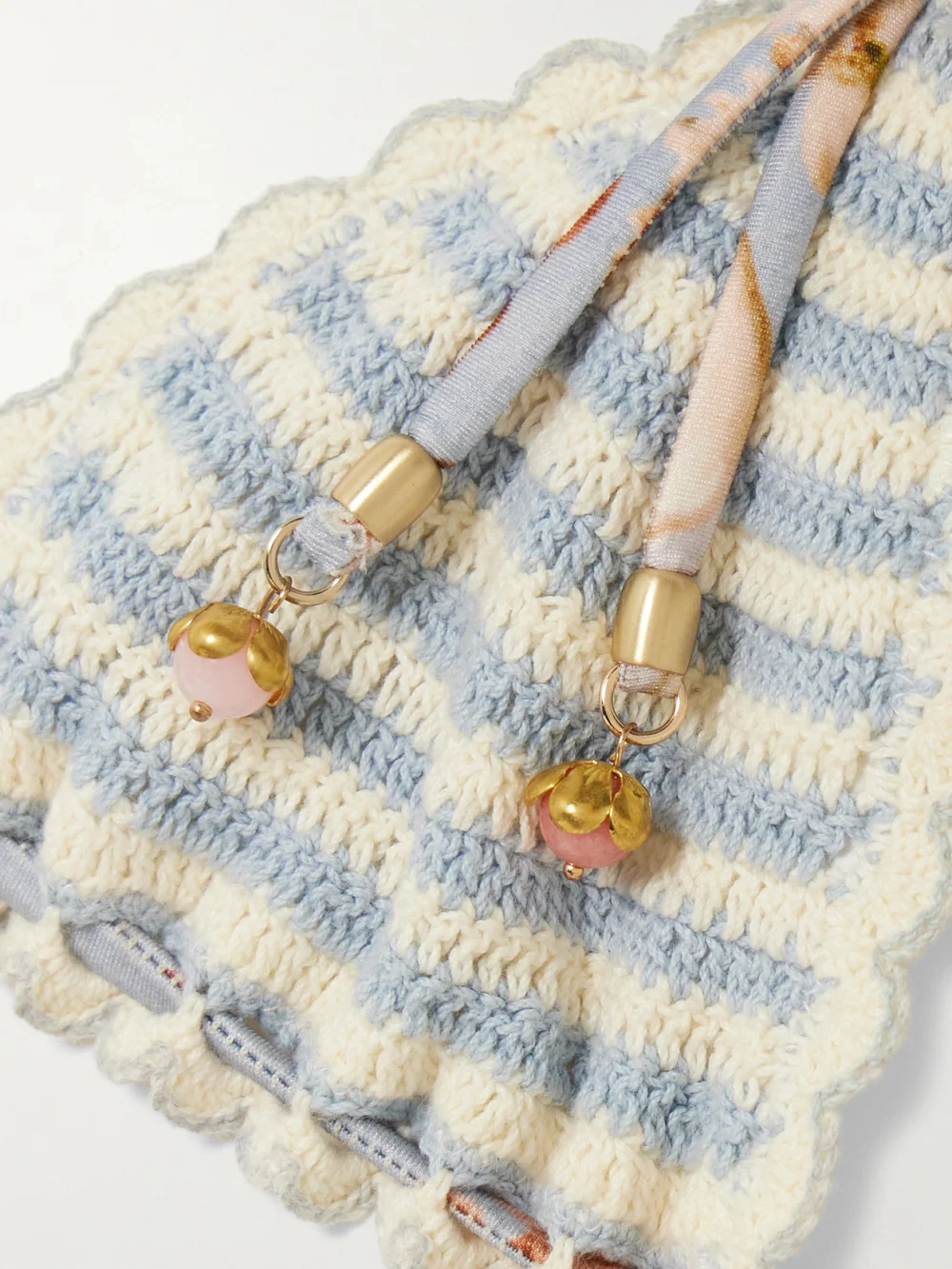 Close-up detail of the Zimmermann Awaken Striped Crocheted Cotton Bikini Top