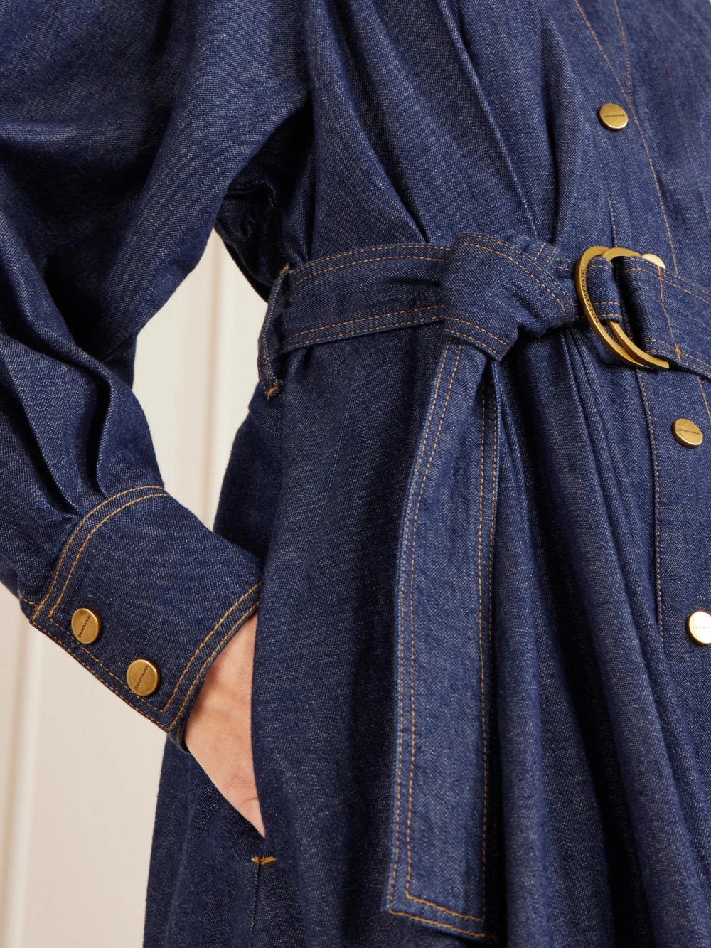 Close-up detail of the Zimmermann Belted Denim Midi Dress
