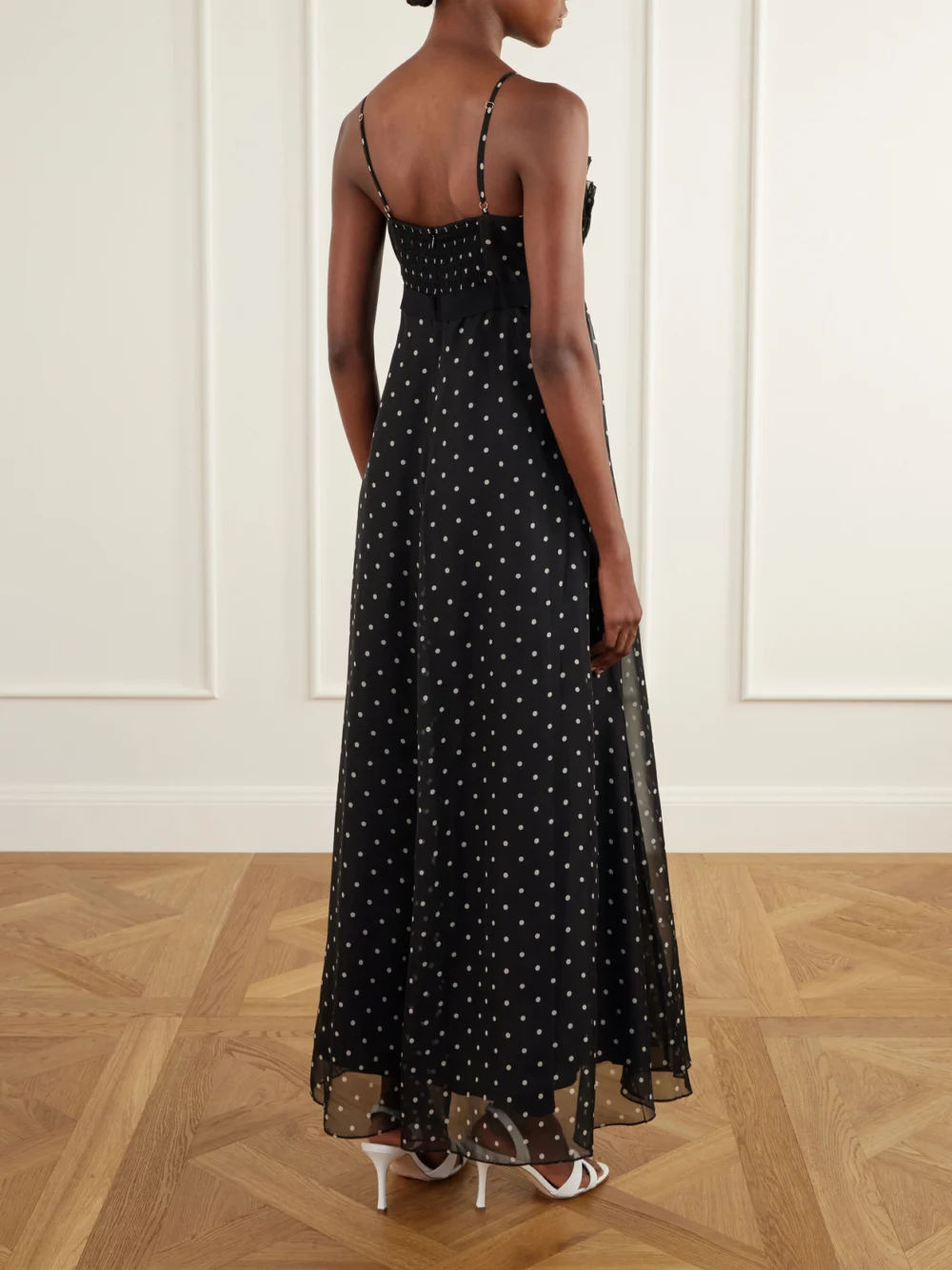 Back view of the Zimmermann Bow-detailed Pleated Ruffled Polka-dot Chiffon Maxi Dress