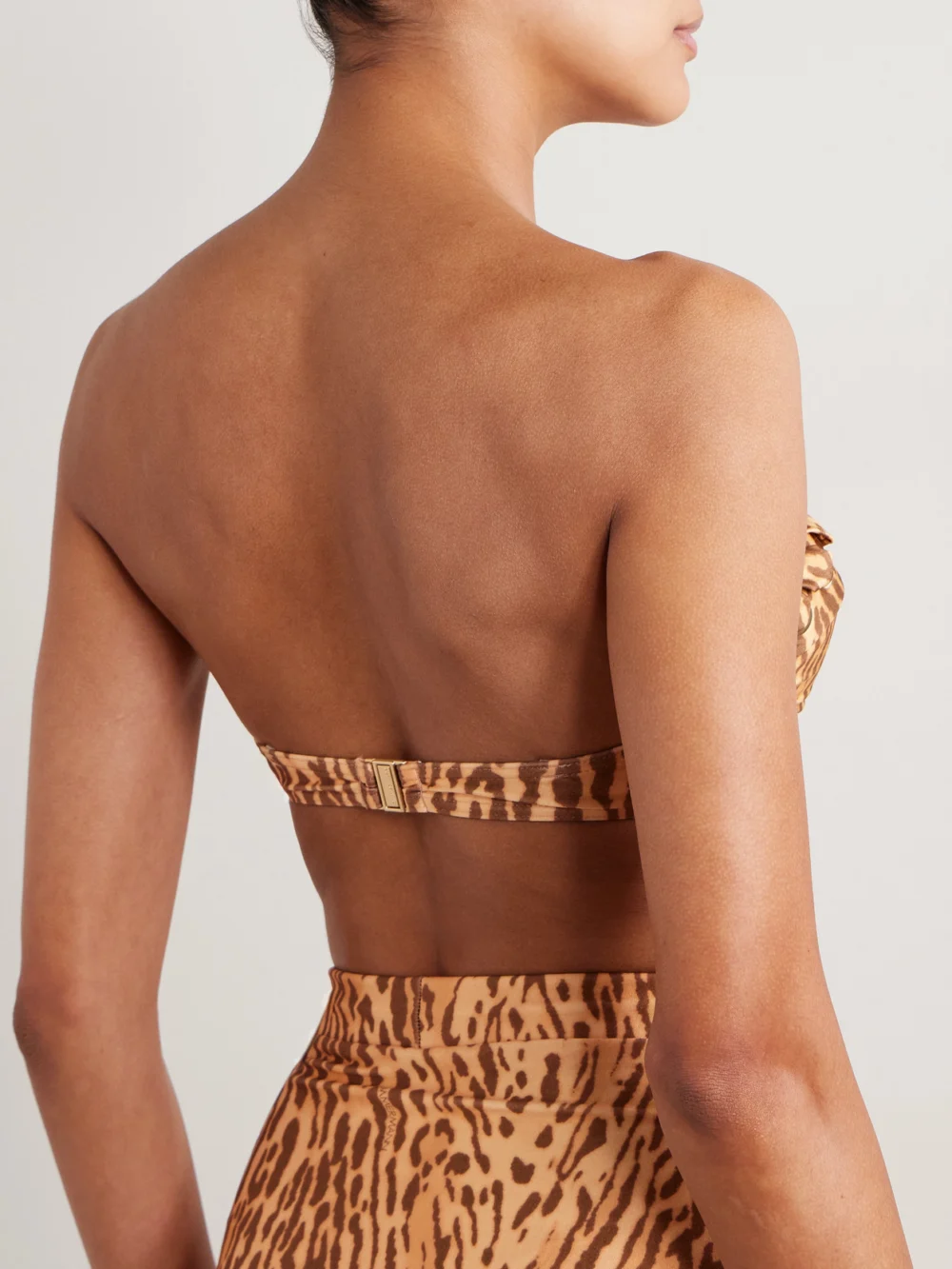 Back view of the Zimmermann Cascadian Strapless Whipstitched Leopard-print Underwired Bikini Top