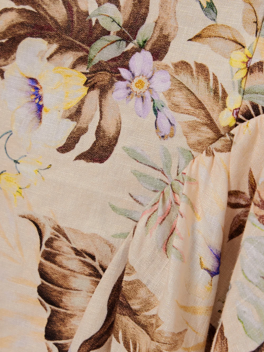 Close-up detail of the Zimmermann Coco Bow-embellished Cutout Floral-print Linen Midi Dress