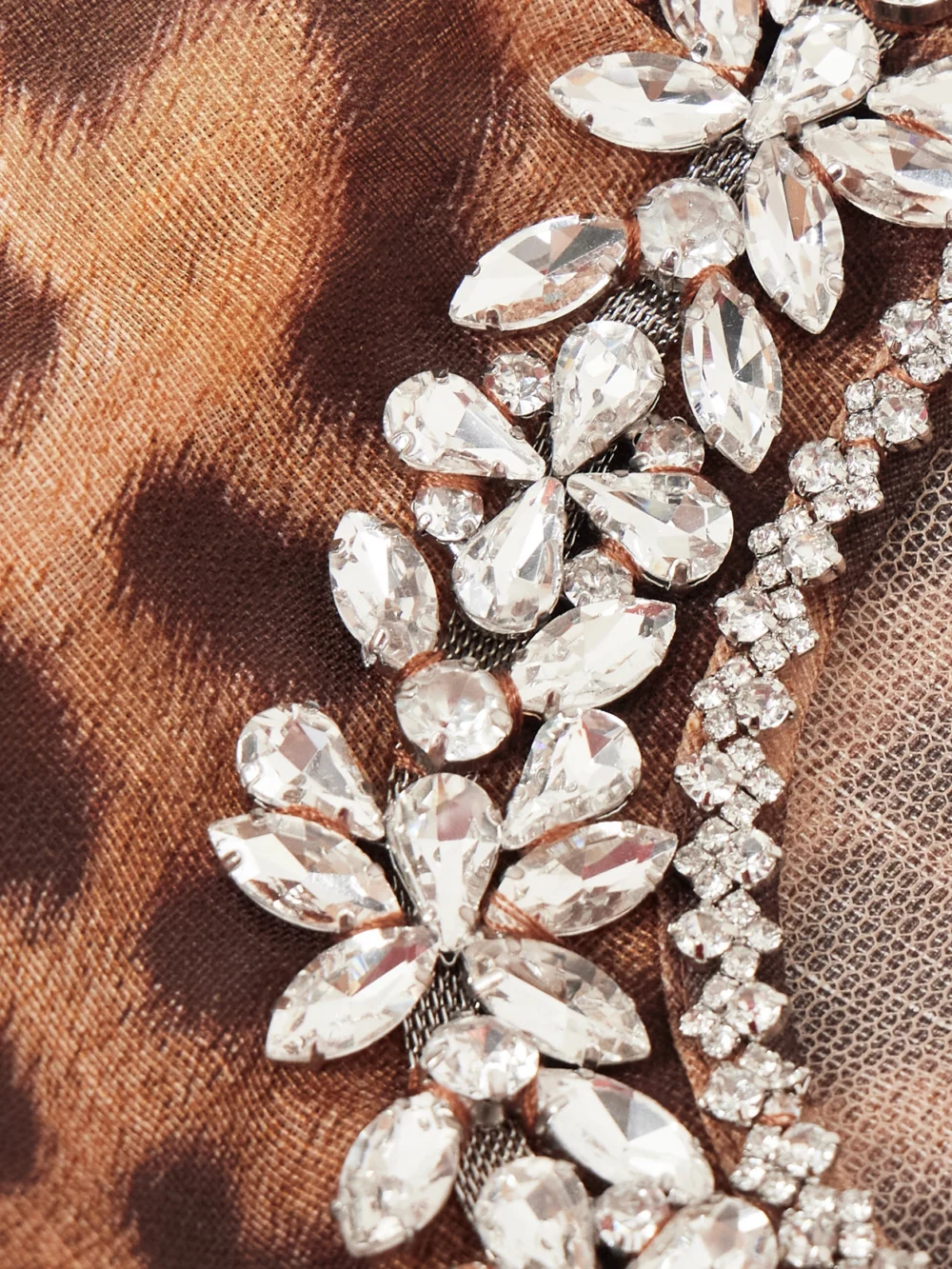 Close-up detail of the Zimmermann Crush Crystal-embellished Paneled Leopard-print Linen and Silk-blend Mini Dress