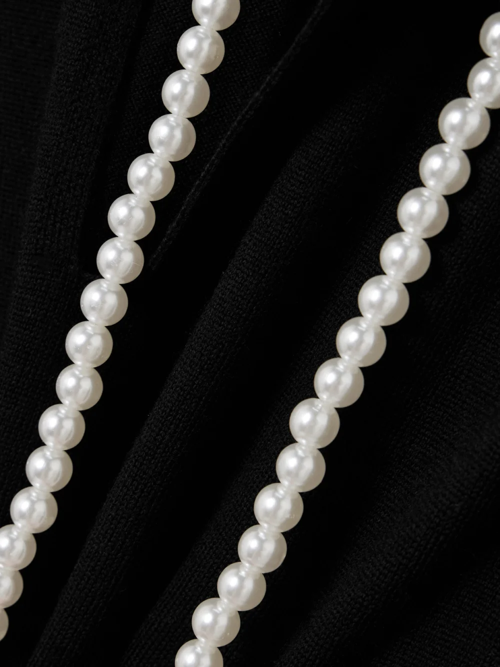 Close-up detail of the Zimmermann Crush Faux Pearl-embellished Wool Mini Dress