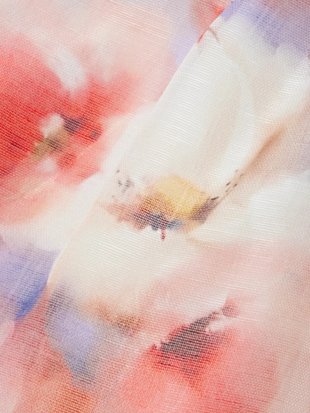 Close-up detail of the Zimmermann Crush One-sleeve Floral-print Linen and Silk-blend Mini Dress