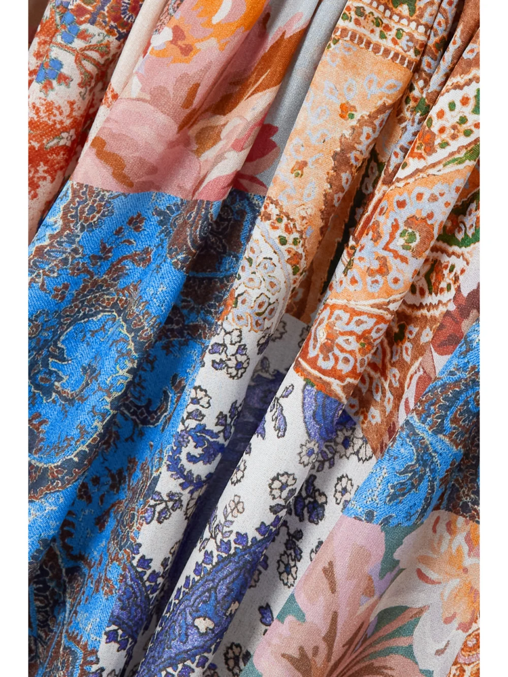 Close-up detail of the Zimmermann Devi Pleated Paisley-print Silk Halterneck Midi Dress